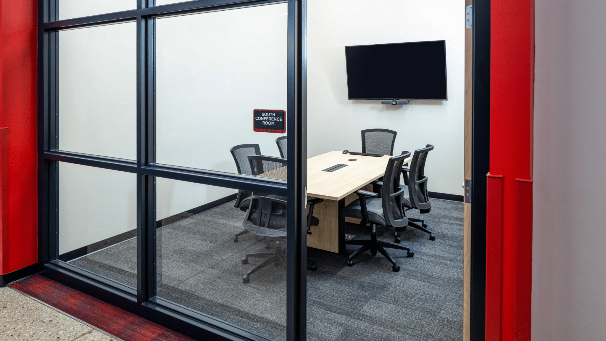 Collaboration Areas - small conference room with 6 chairs