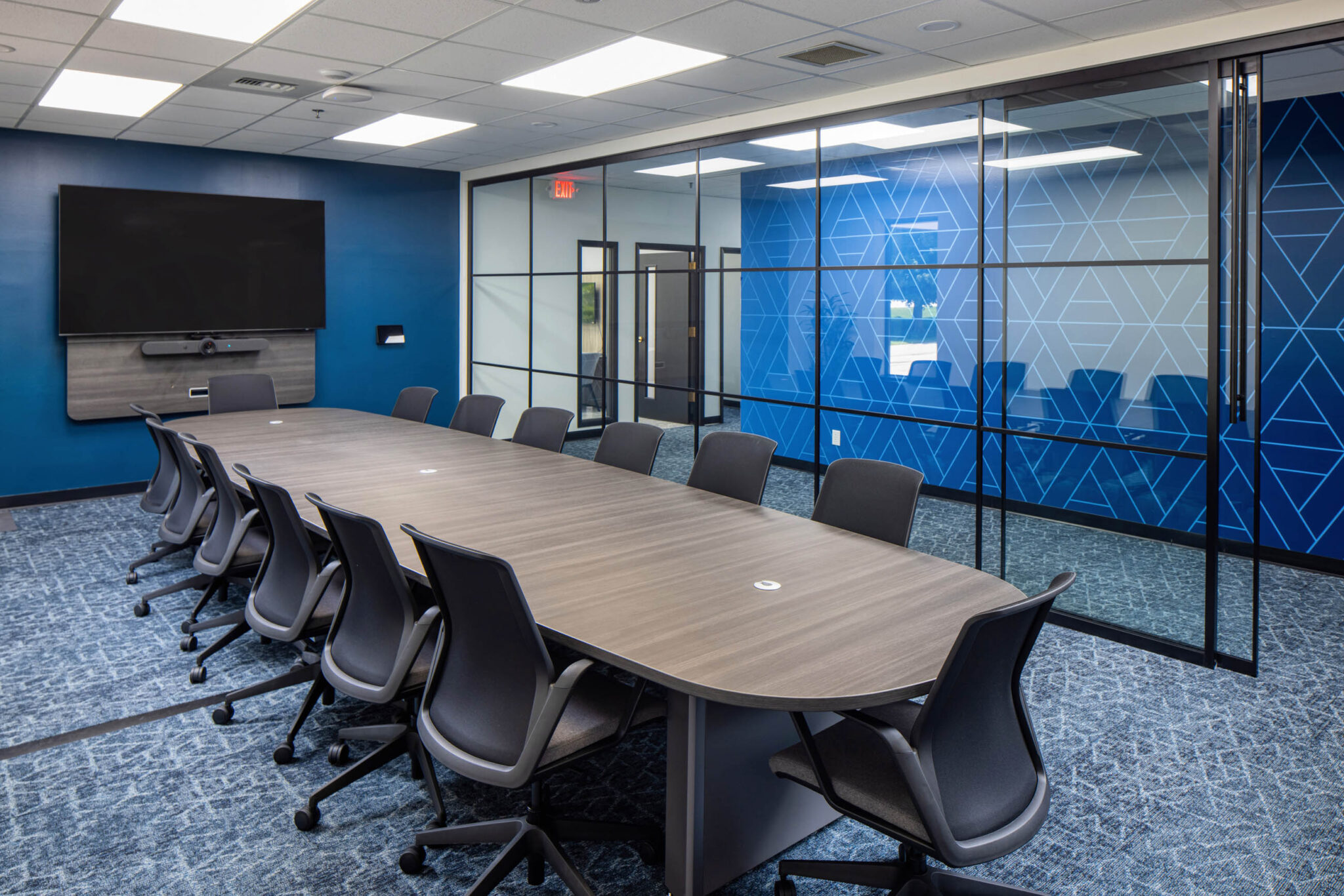 Boardroom interior design at Acrisure in Northeast Wisconsin by CJ & Associates, featuring modern commercial workplace design solutions.