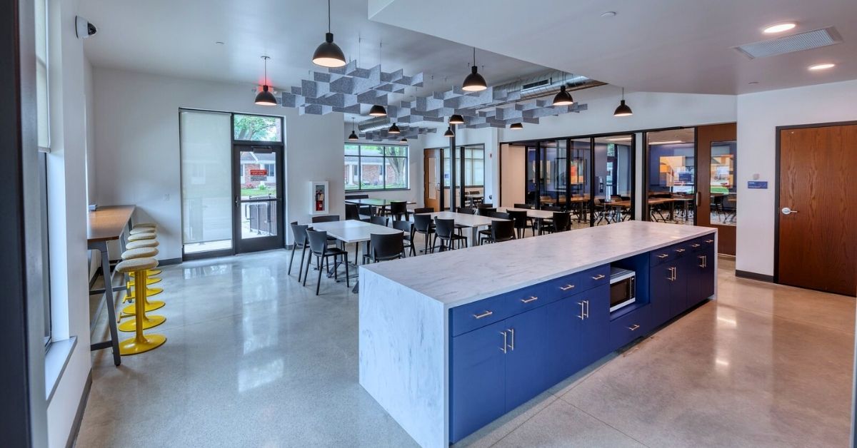 Modern community space at Brown County United Way – City East Center with flexible seating, café area, and acoustic ceiling panels.