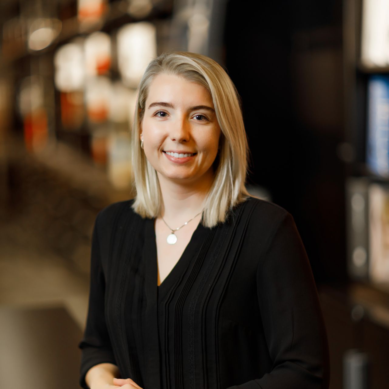 Grace Heinen NCIDQ Certified Interior Designer at CJ & Associates working on commercial design plans