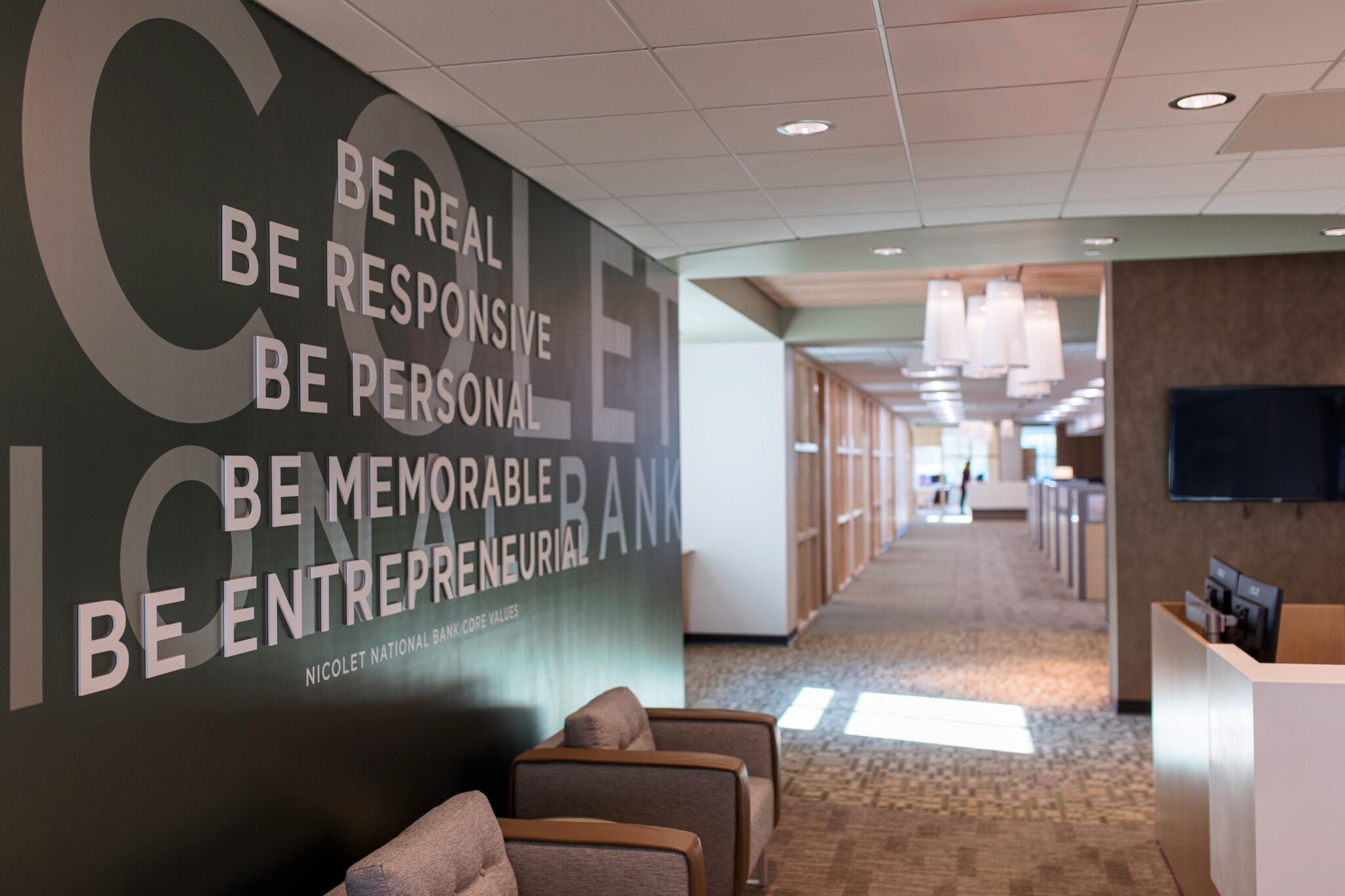Lobby interior design for Nicolet Bank in Northeast Wisconsin by CJ & Associates, featuring new construction commercial interiors.