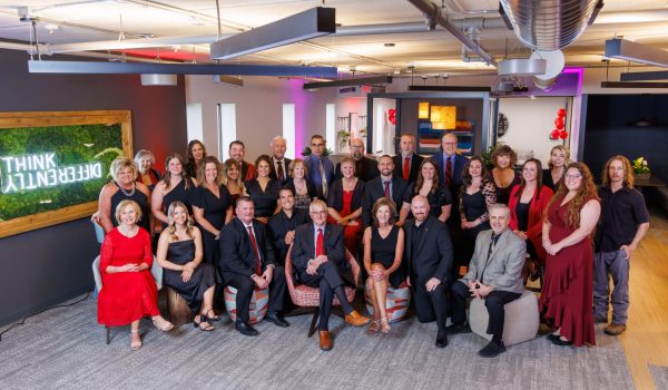 The entire CJ & Associates team celebrating 40 years of success in commercial interior design and installation