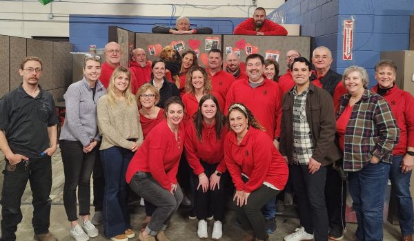 CJ & Associates team showing support for heart health by wearing red for the American Heart Association awareness event